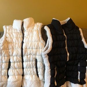 2 Calvin Klein Sherpa trim puffer vests.